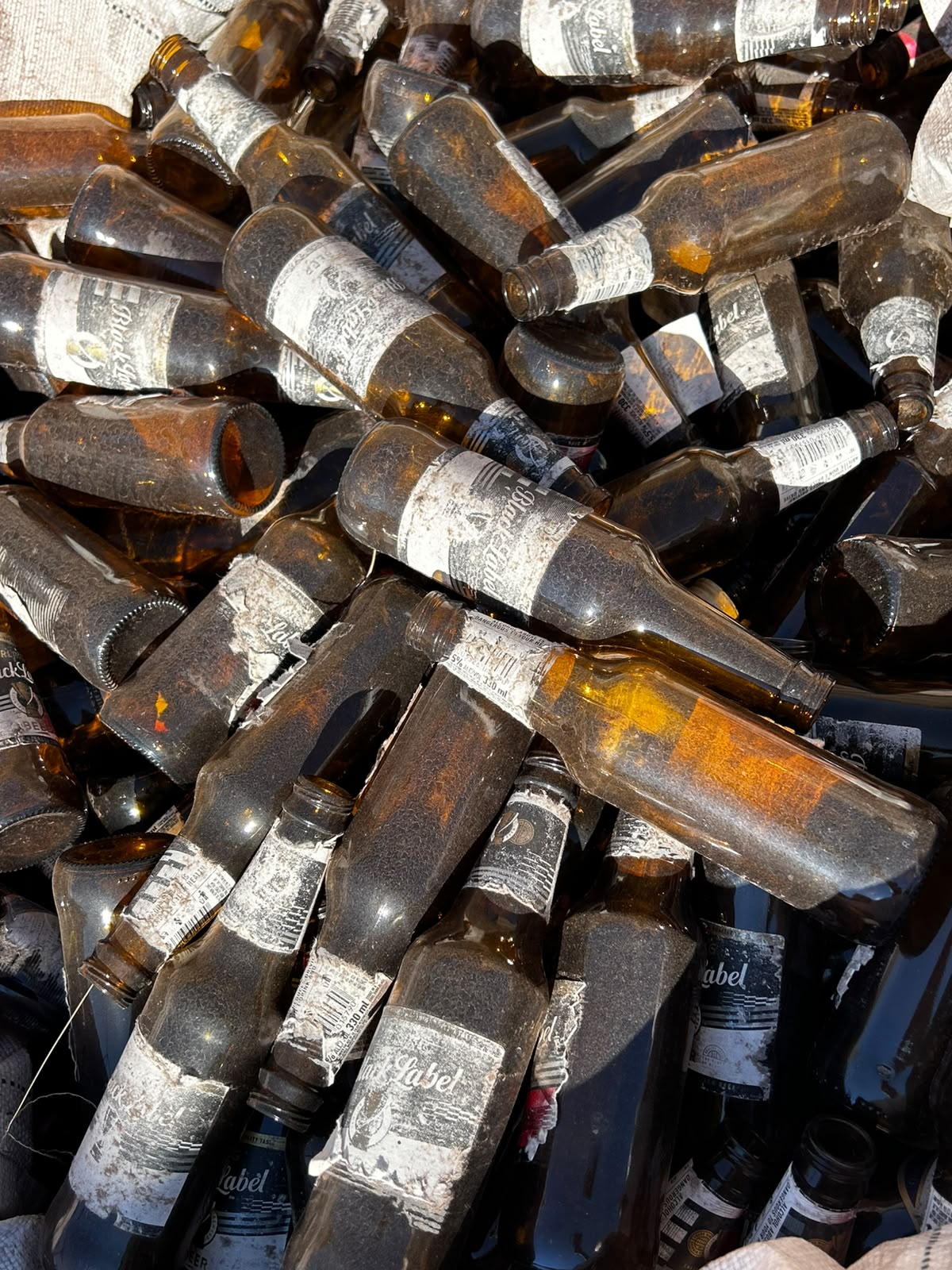 Brown glass bottles prepared for recycling